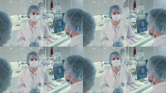 新型冠状病毒肺炎多样化的实验室团队致力于冠状病毒样品。穿着防护工作服