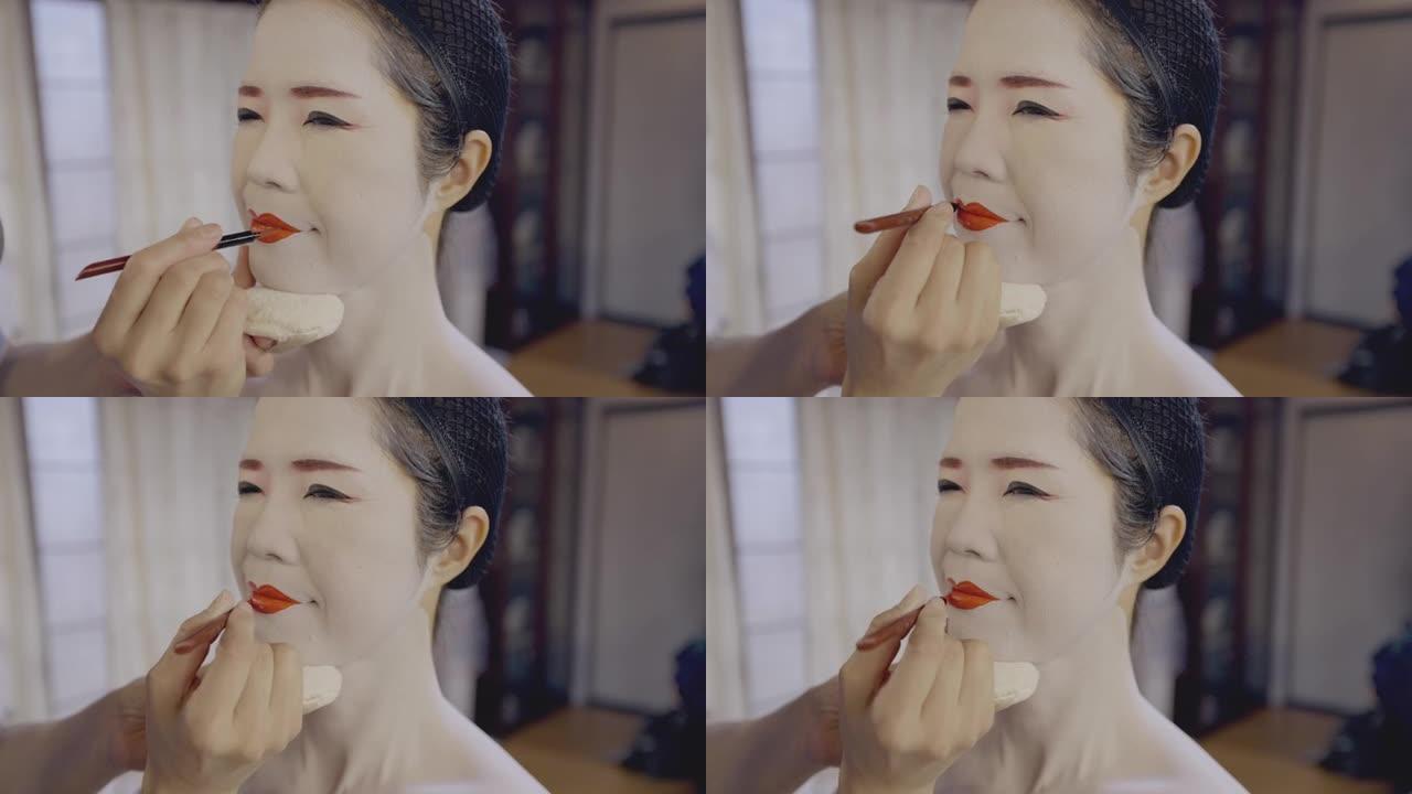 日本女子为艺妓做 “oshiroi' 特制白脸化妆，涂红唇
