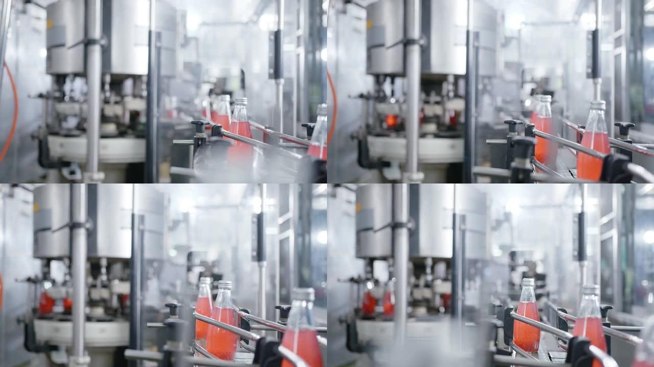 装瓶厂机械生产线-红色果汁装瓶生产线，用于加工和装瓶果汁。选择性聚焦工业技术业务概念