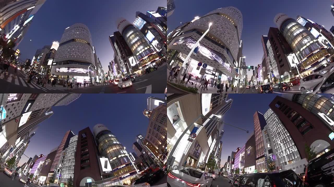在城市里骑自行车。抬头看看周围。骑自行车穿越日本东京银座。动作相机拍摄。