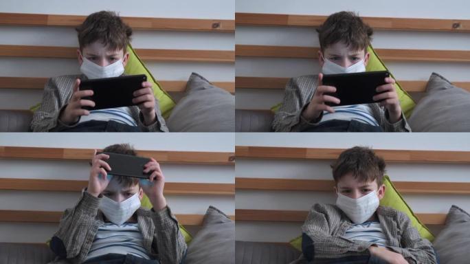 检疫冠状病毒新型冠状病毒肺炎期间，男孩脸上戴着医用口罩，病毒情绪激动地在智能手机上玩游戏，紧张地把手