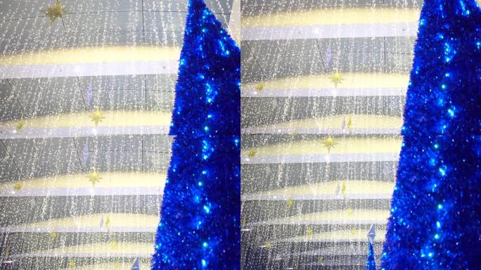 公共场所的圣诞树及装饰品。主题在右边。镜头从上到下移动。