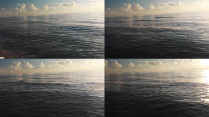 Pov视图在水面附近向前飞行，直到深海有平静的缎面水面
