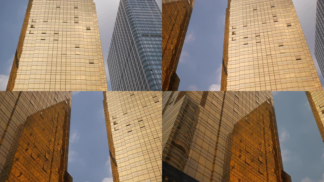 阳光明媚的日子广州城市现代市中心摩天大楼立面向上观看慢动作全景4k中国