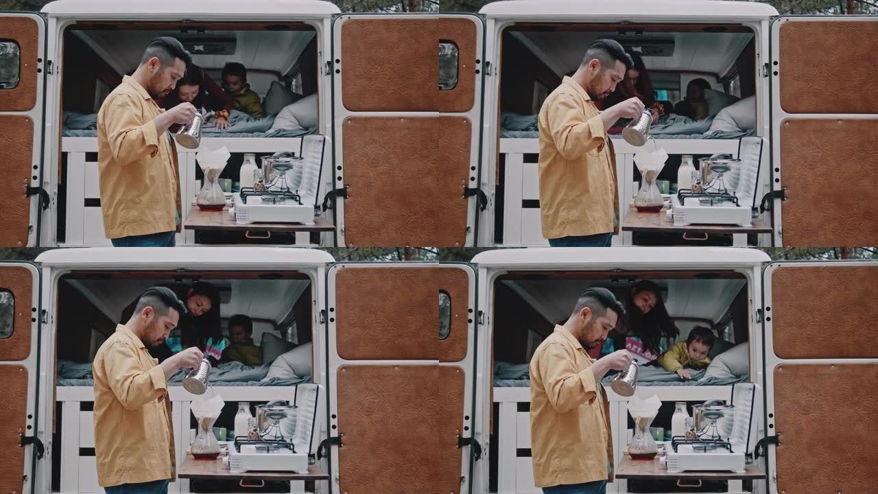 亚洲家庭在早上用迷你面包车进行公路旅行时煮咖啡