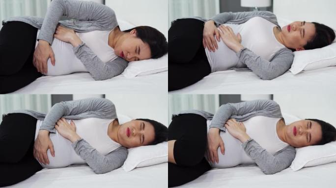 孕妇在床上胃痛