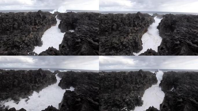 泡沫波和水在岩石缝隙中的力量。