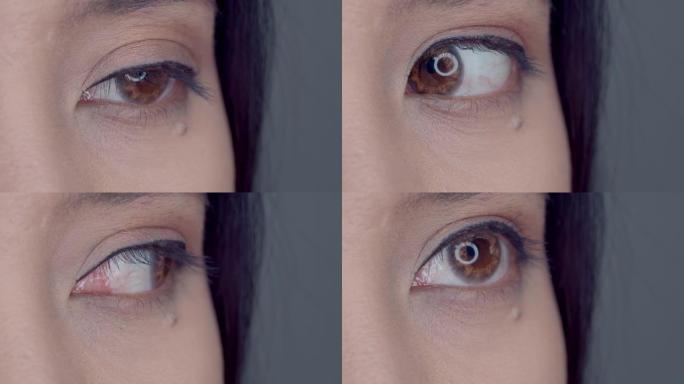 用漂亮年轻女人的隐形眼镜特写美丽的眼睛