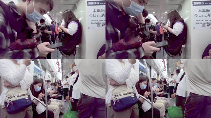 地铁玩手机的乘客