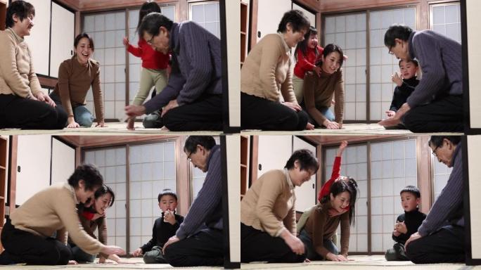 亚洲多代家庭玩karuta，日本传统纸牌游戏