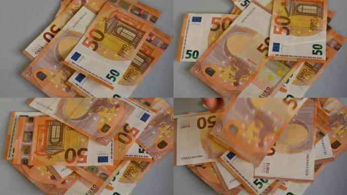一个人数50欧元纸币，欧盟货币，现金货币计算