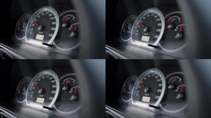 一个汽车仪表盘的特写，上面有一个速度计，显示车速为每小时60公里