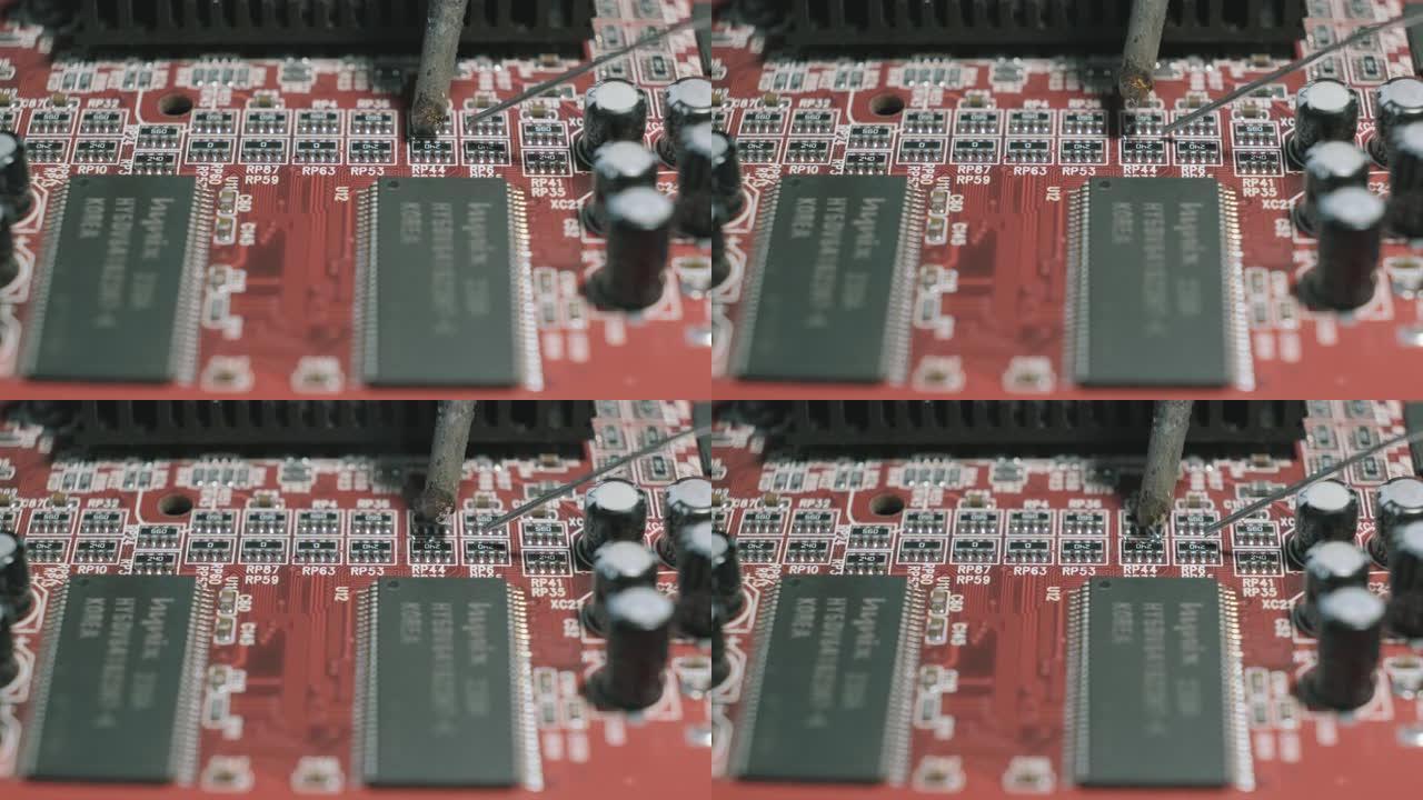 使用烙铁修理计算机电路板零件的特写镜头。