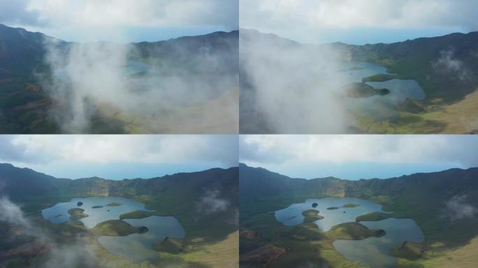 绿色死火山破火山口中间的浅湖被云层覆盖。亚速尔群岛科尔沃航空公司