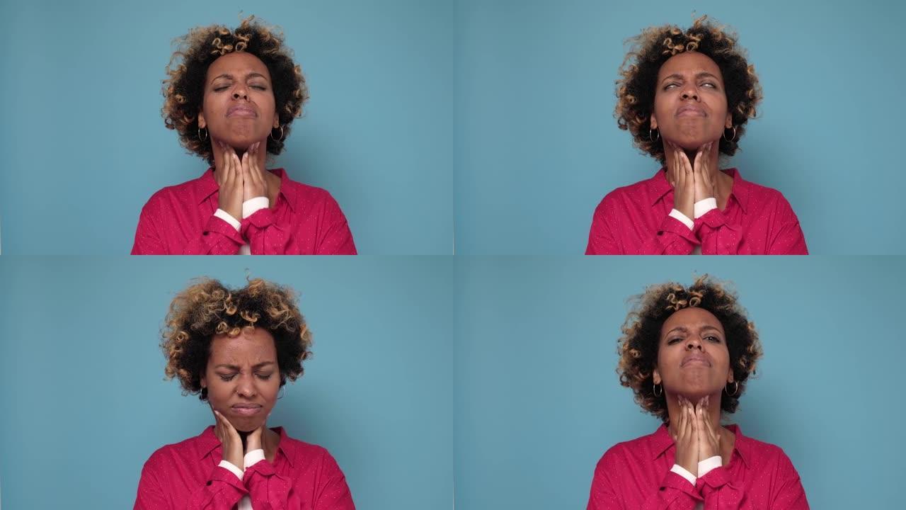 非洲裔美国妇女用卷发触摸脖子感到不适痛苦的感觉难以吞咽，喉咙痛疼痛刺激。