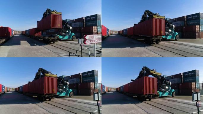 俄罗斯叶卡捷琳堡-2020年10月17日: 集装箱搬运工在港口码头的火车上装载红色集装箱。FHD。全