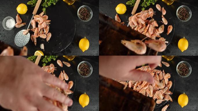 从砧板上煮的虾落在桌子上。