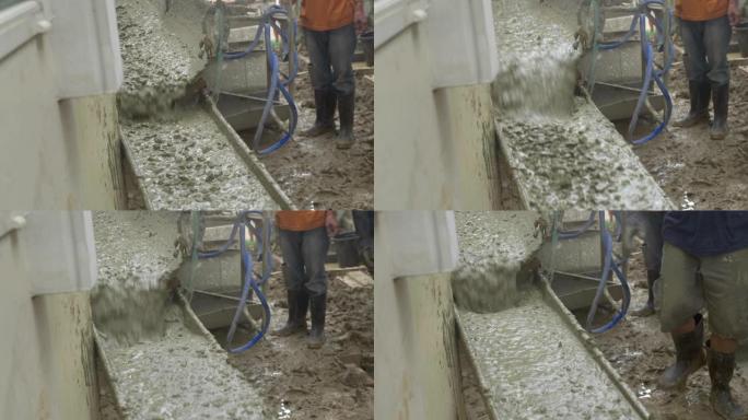 搅拌机水泥车浇筑物料在给水管上的建筑工地