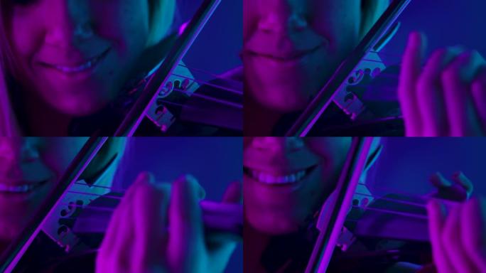 木制小提琴和弓的详细镜头。专业小提琴手在明亮的霓虹灯的背景下演奏古典交响曲。女人的脸和银子工具特写。