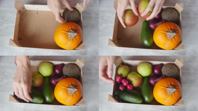 女人的手把水果和蔬菜放进盒子里