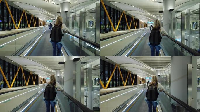 国际机场自动扶梯上的女人