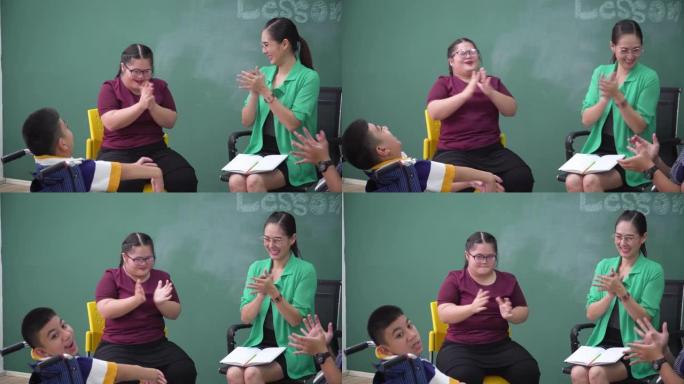 拍拍你的手，一个患有唐氏综合症的女孩与积极的情绪微笑的朋友在轮椅上的亚洲老师在课堂上交谈，交流，练习