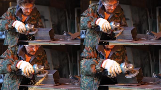 工人用研磨机磨平铁料