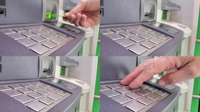 一个人在本地银行的atm机上使用借记卡提款，同时在机器键盘上键入pin码