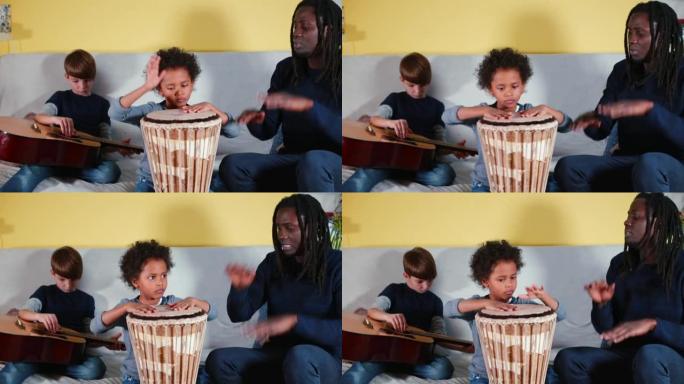 黑人父亲教孩子们打儿子鼓。展示技术打击jambe