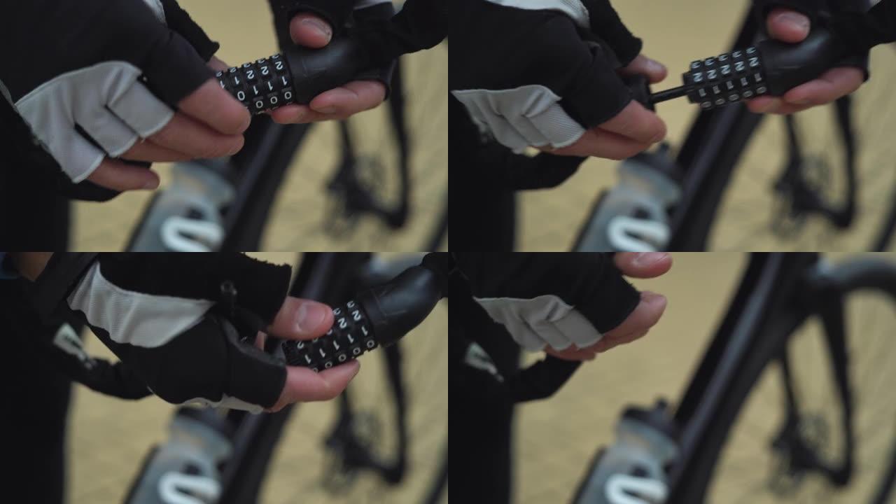 男性手在密码锁上拿起一个数字组合并打开它。自行车锁概念