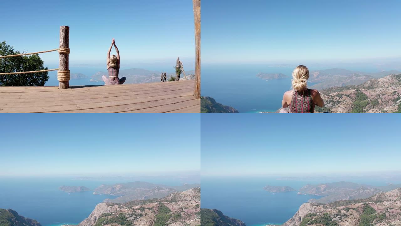 女孩正在悬崖边做瑜伽。
