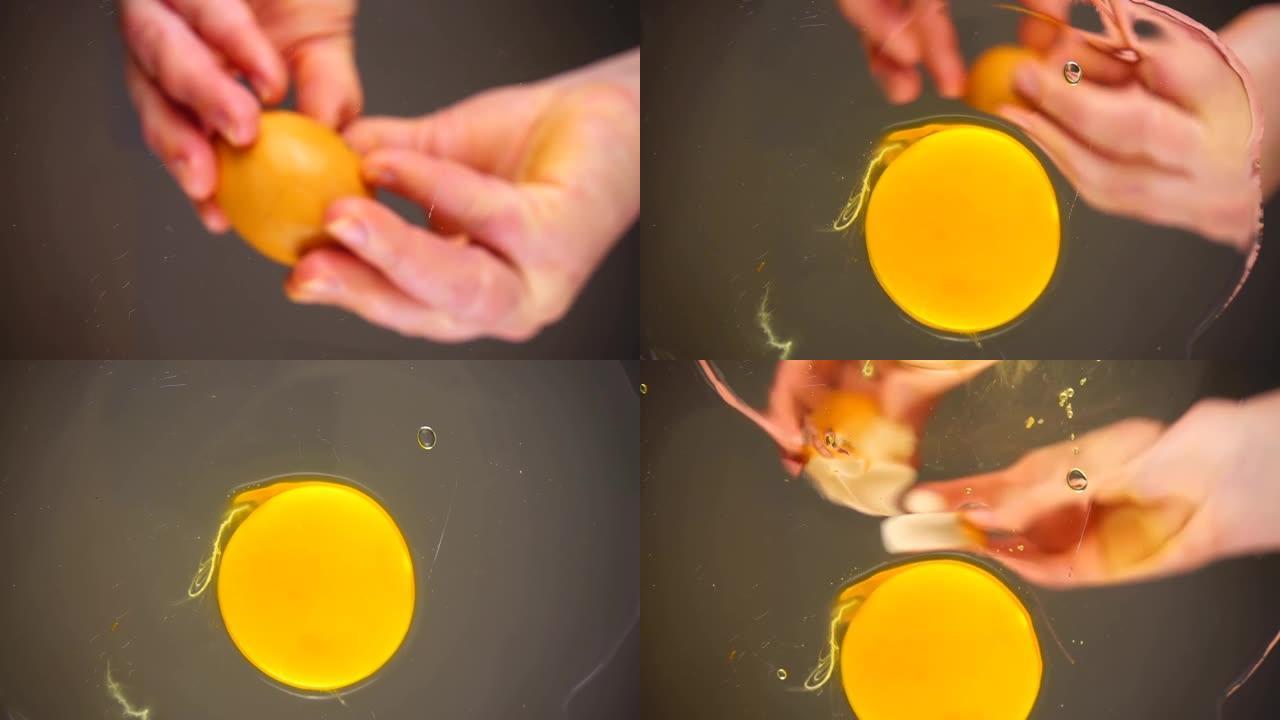 生鸡蛋被打碎成玻璃碗。底视图。