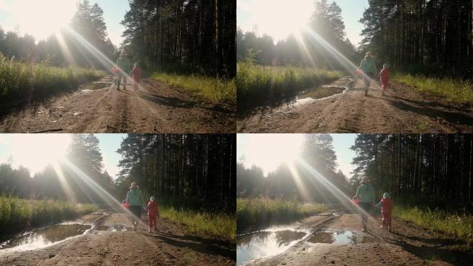 6岁的小女孩，带着一张蝴蝶网。和妈妈一起在阳光明媚的日子散步。大自然中的森林周末的夏日。在新鲜空气中