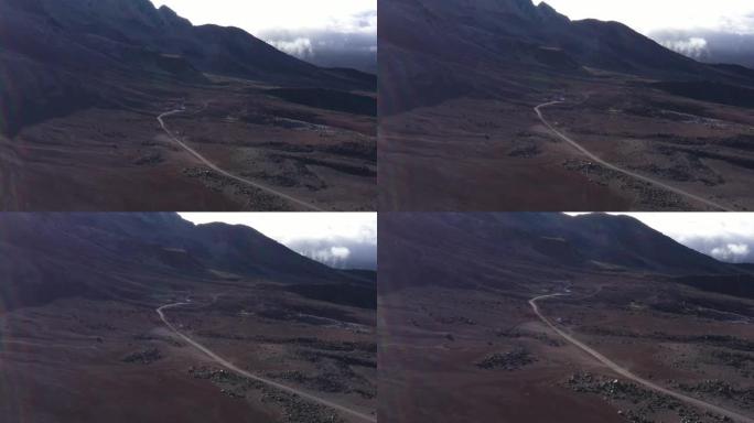 鸟瞰图在chimborazo vulcano山坡上的一条土路上缓慢飞行，到达第一个难民