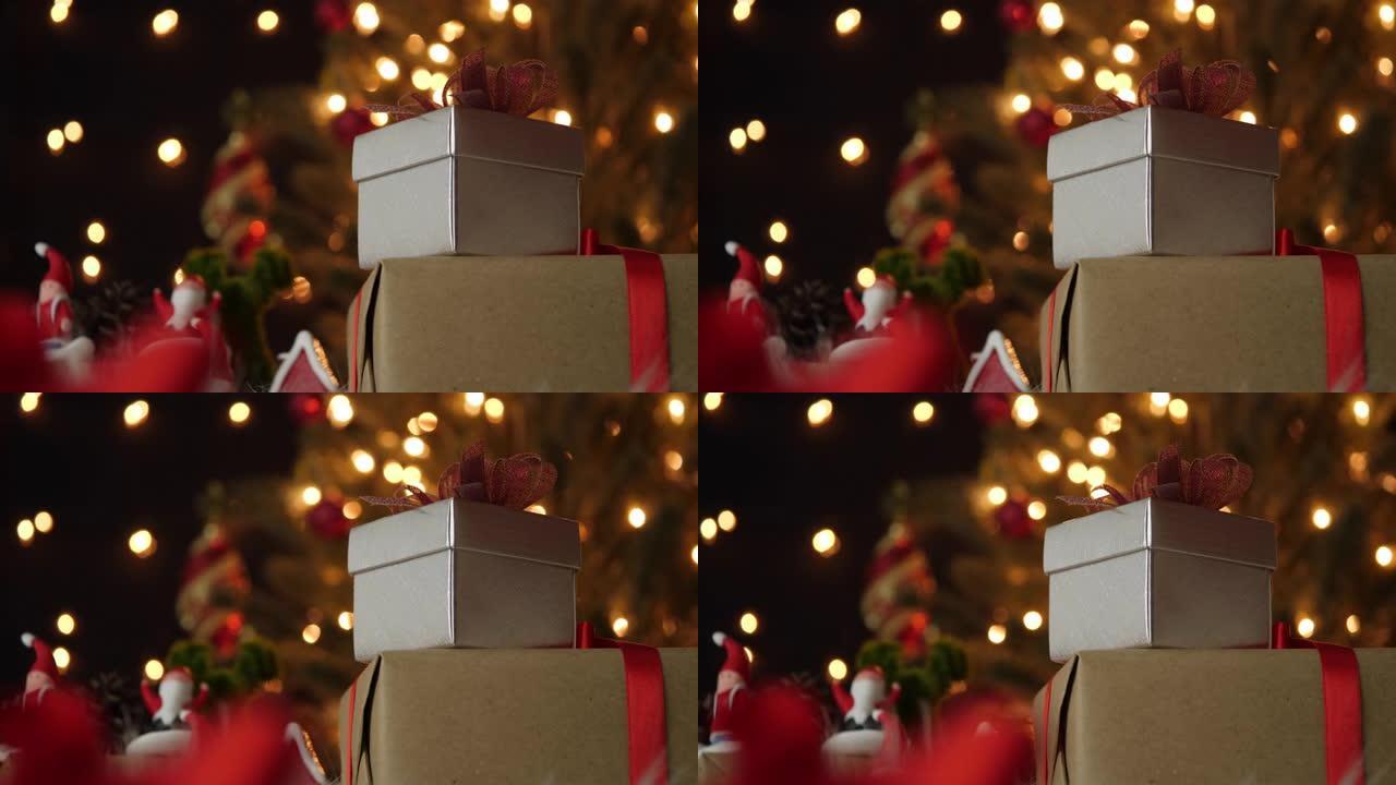 晚上桌上的银色礼品盒和圣诞装饰品