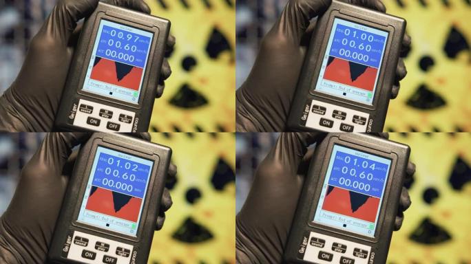 科学家拿着盖革计数器测量核设施每小时辐射的微西弗。核灾难和辐射沉降概念。