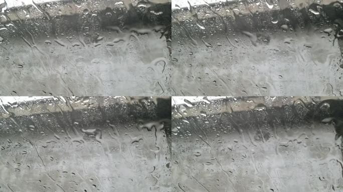 雨水撞击玻璃整合水滴