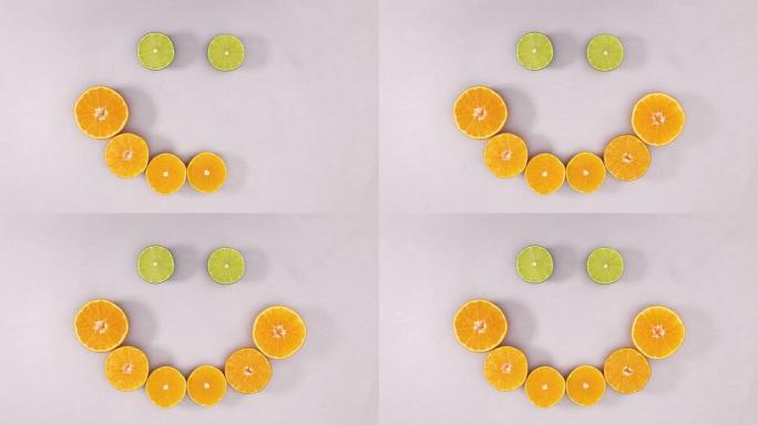 橙子和酸橙片制作笑脸。停止运动