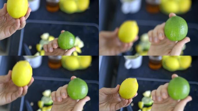 女性的手在水果片上拿着柠檬和酸橙