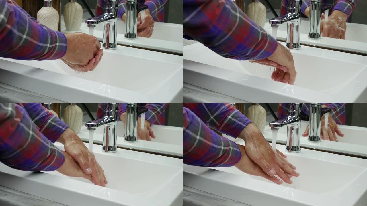 用水在水龙头下洗手，一个人洗去手上的污垢，防止冠状病毒感染，手部消毒