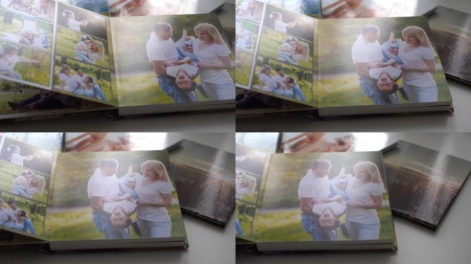 特写。一名妇女翻阅花园里家庭照片拍摄的相册。美丽方便的照片存储。重要时期的记忆。