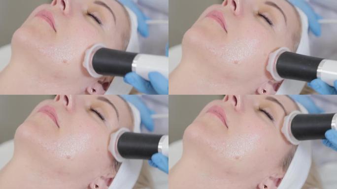 专业美容师用羧基治疗仪治疗女人的脸