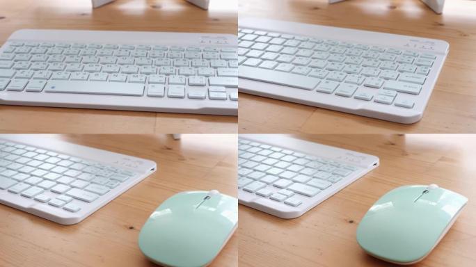 绿色薄荷电脑键盘和无线鼠标，用于桌子上的数字平板电脑。