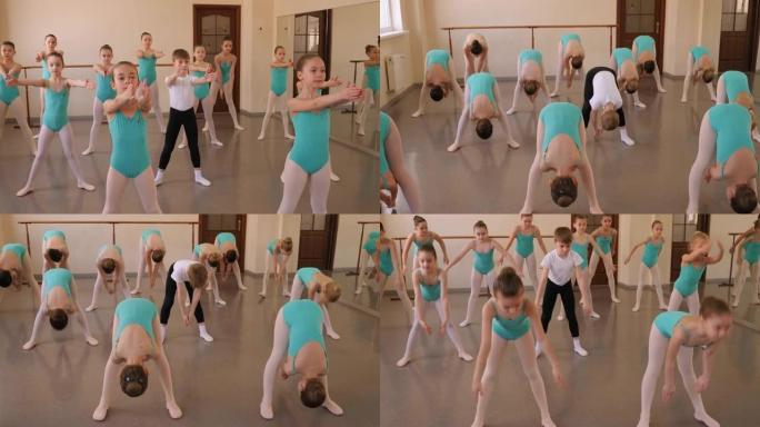 一群芭蕾舞女孩在舞蹈课前做伸展运动。