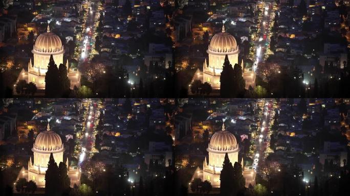 夜灯照亮的海法巴海寺的金色圆顶。
汽车在晚上穿过城市。