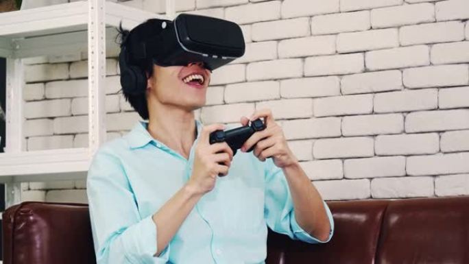 戴着虚拟现实眼镜的亚洲男人在现代家庭中体验创新技术，一个英俊的男人在阳光明媚的日子里使用VR眼镜玩游
