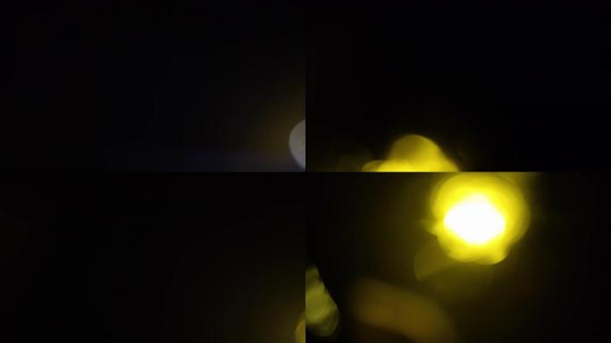 抽象波克黄光移动的慢动作长镜头。4k的漏光镜头。
