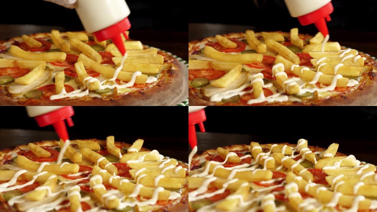 将白色酱汁倒入现成的比萨饼和炸薯条的特写镜头