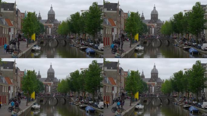 多云的一天阿姆斯特丹市中心著名的大教堂运河景观慢动作全景4k荷兰
