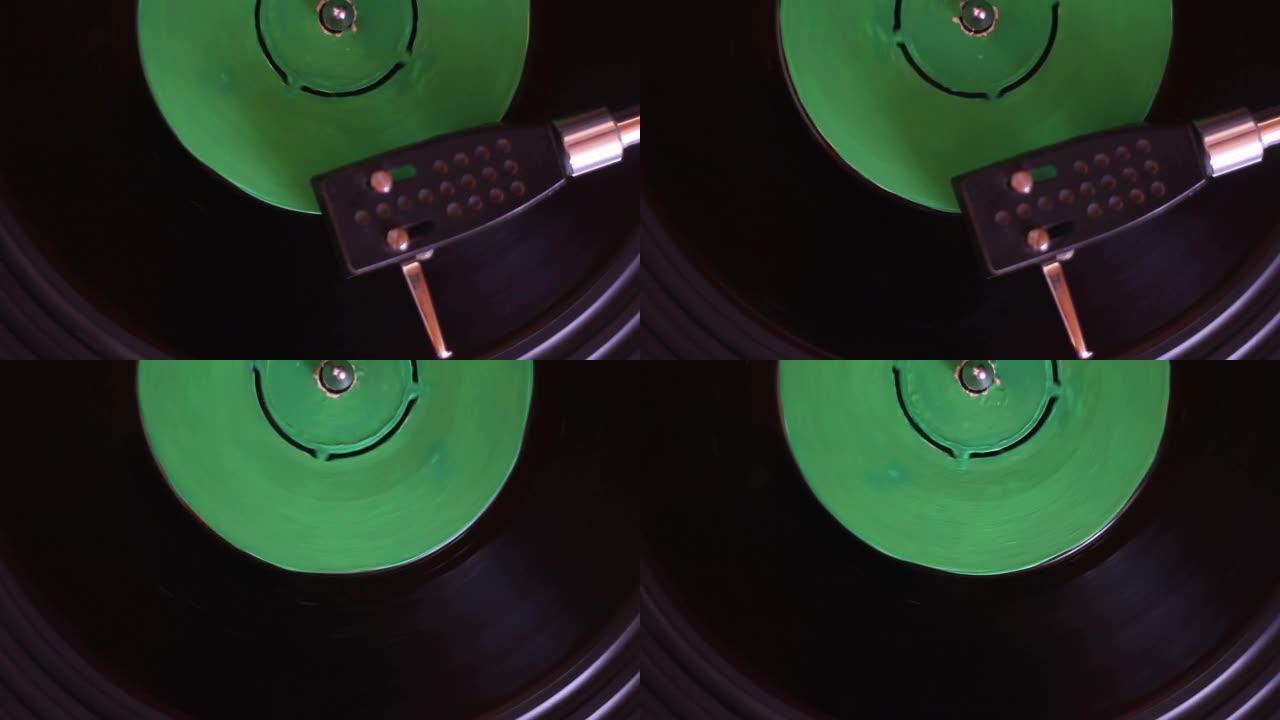 黑胶唱片上转盘针的特写。播放乙烯基的转盘。